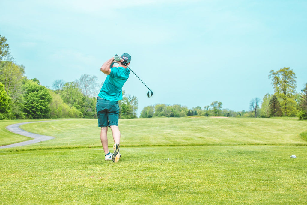 Image of a golf course with people playing golf