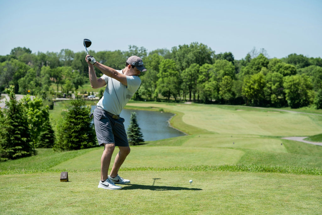 Image of a golf course with people playing golf