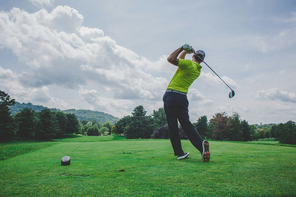 Image of a golf course with people playing golf