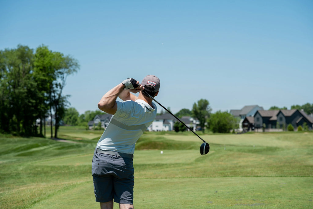 Image of a golf course with people playing golf