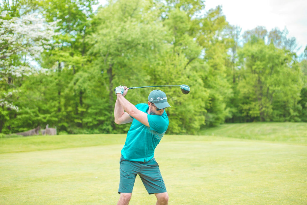 Image of a golf course with people playing golf