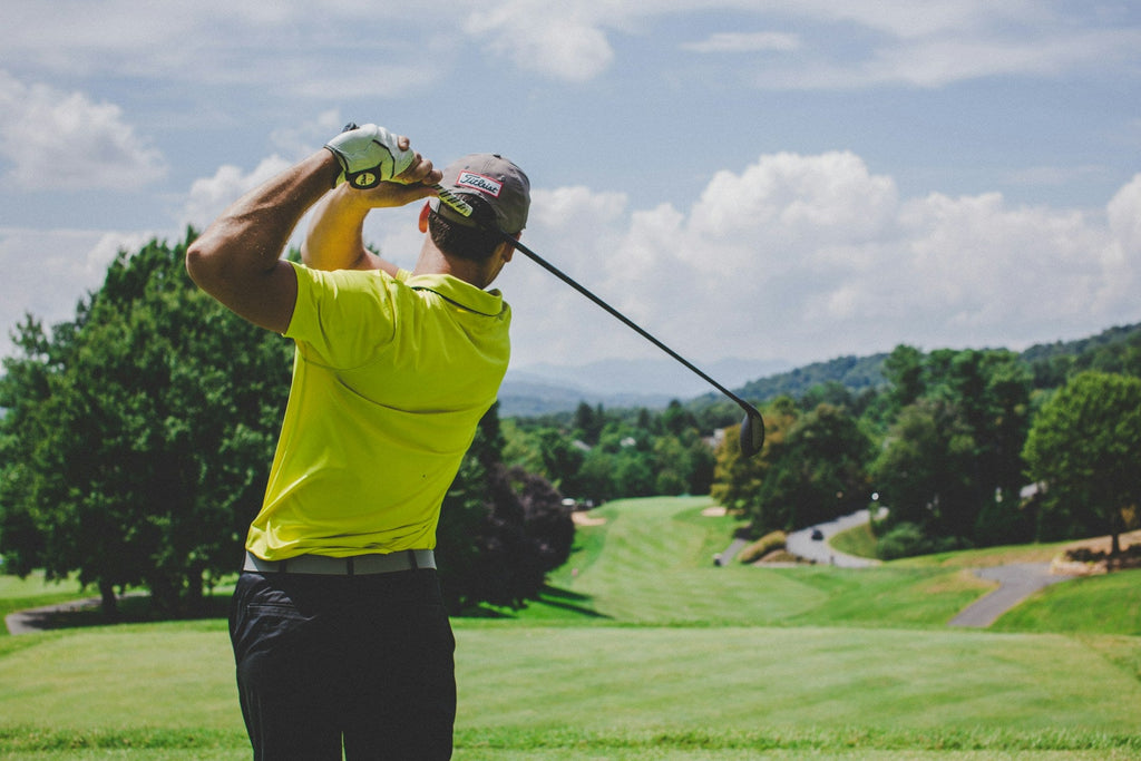 Image of a golf course with people playing golf