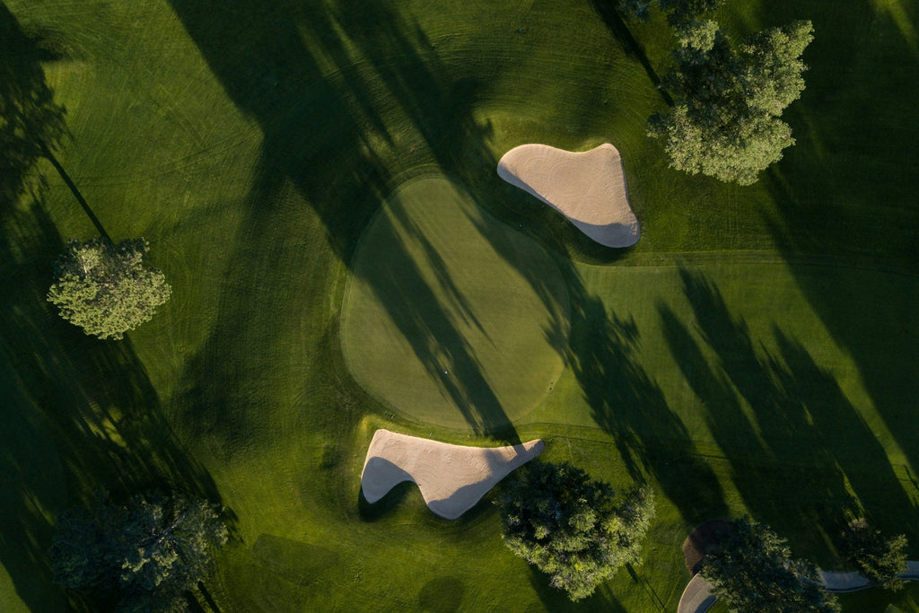 Image of a golf course with people playing golf