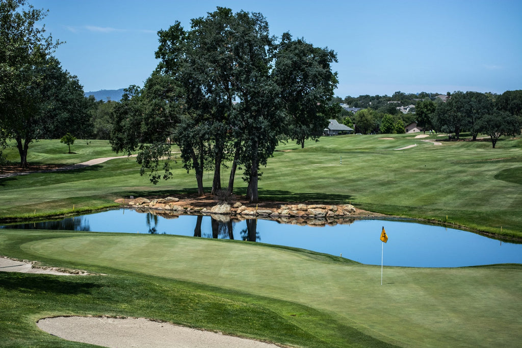 Image of a golf course with people playing golf