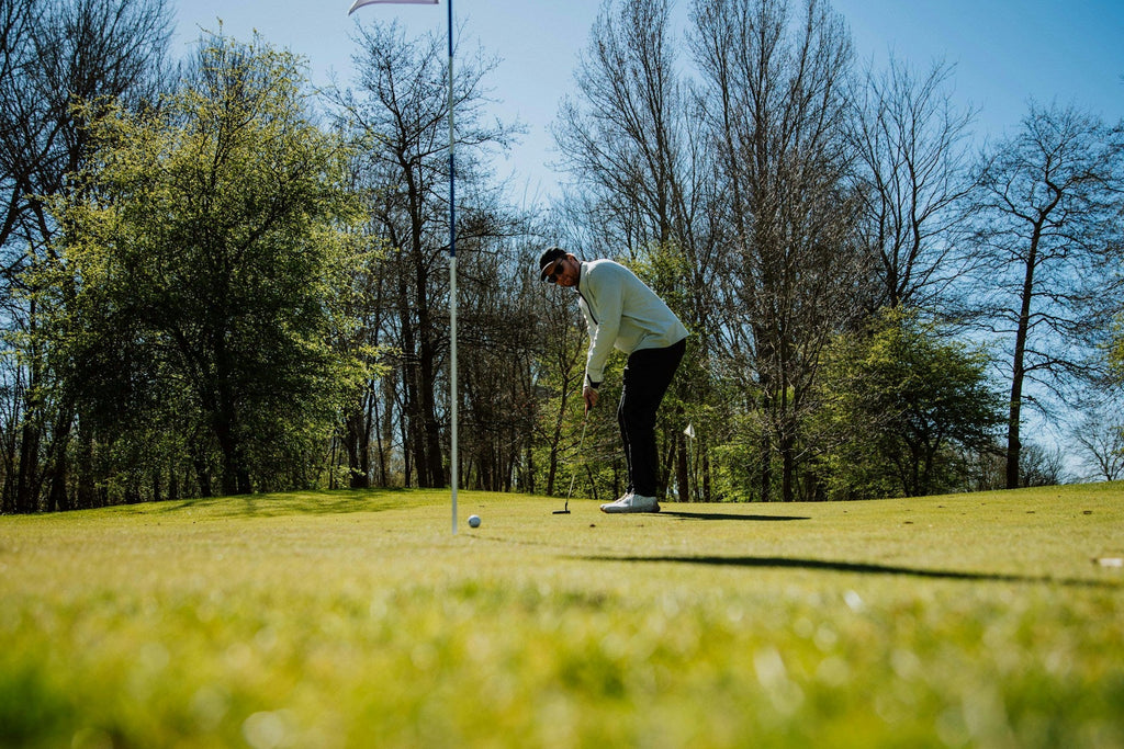 Image of a golf course with people playing golf