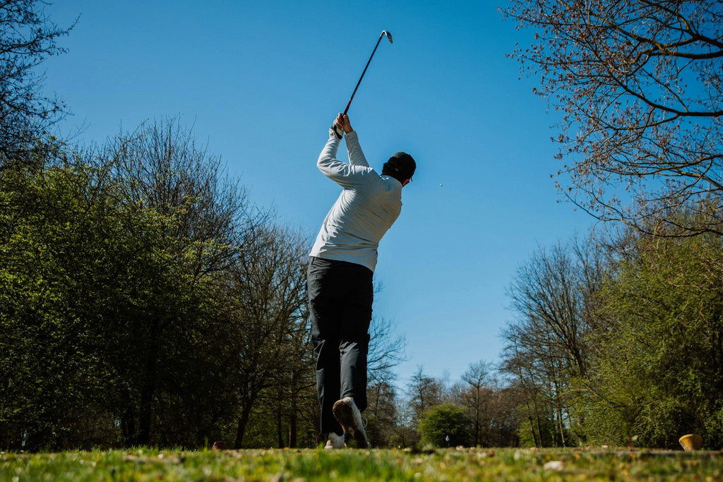 Image of a golf course with people playing golf