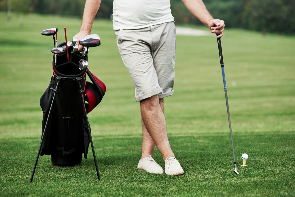 Image of a golf course with people playing golf