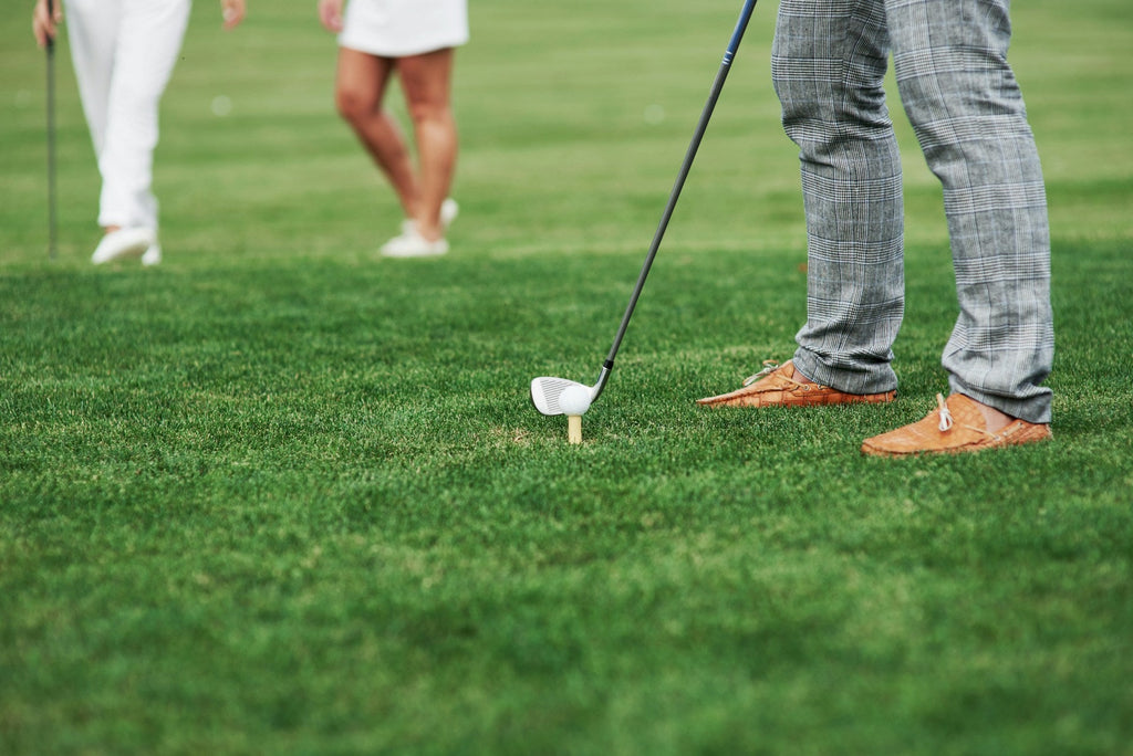 Image of a golf course with people playing golf
