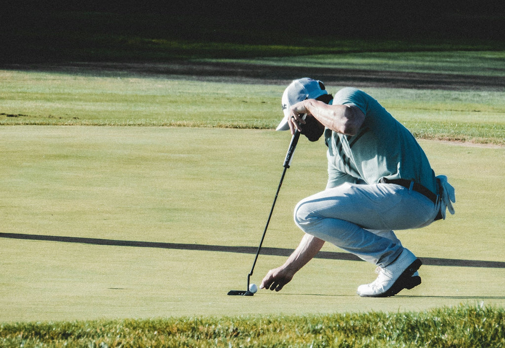 Image of a golf course with people playing golf