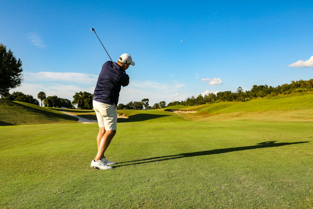 Image of a golf course with people playing golf