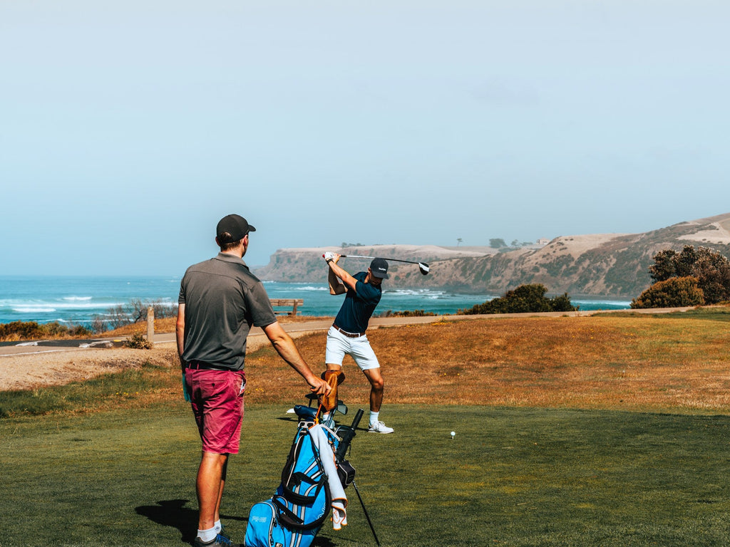 Image of a golf course with people playing golf