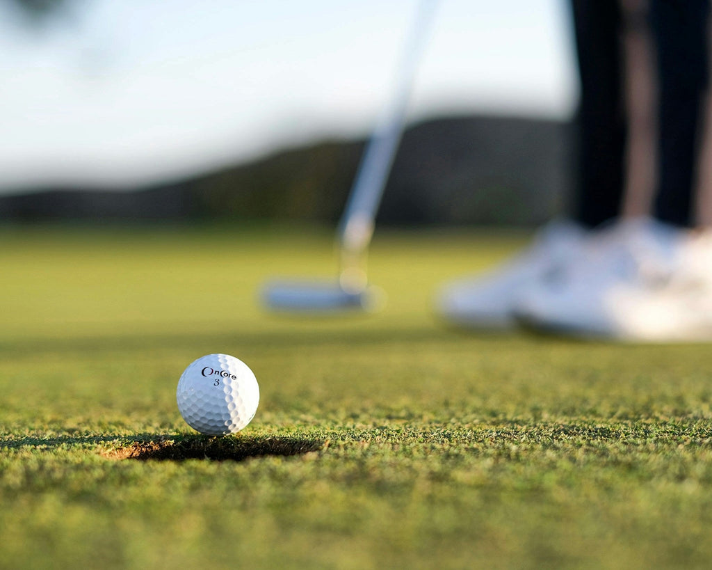 Image of a golf course with people playing golf