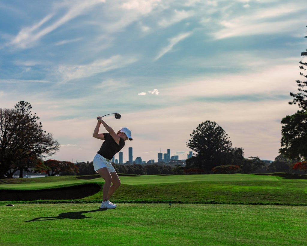 Image of a golf course with people playing golf