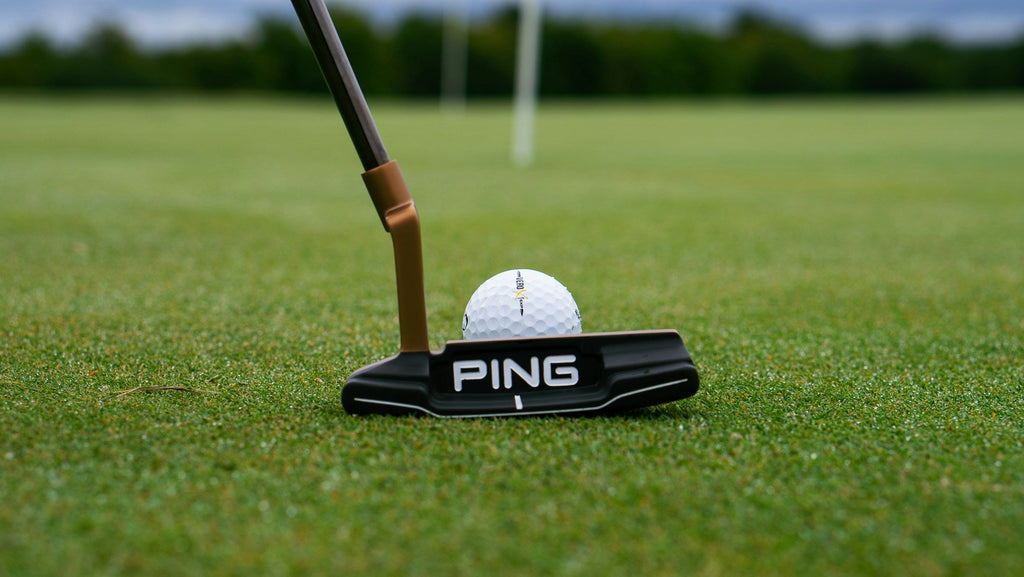 Image of a golf course with people playing golf