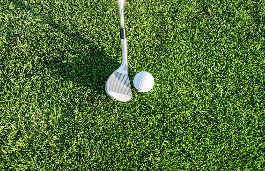 Image of a golf course with people playing golf