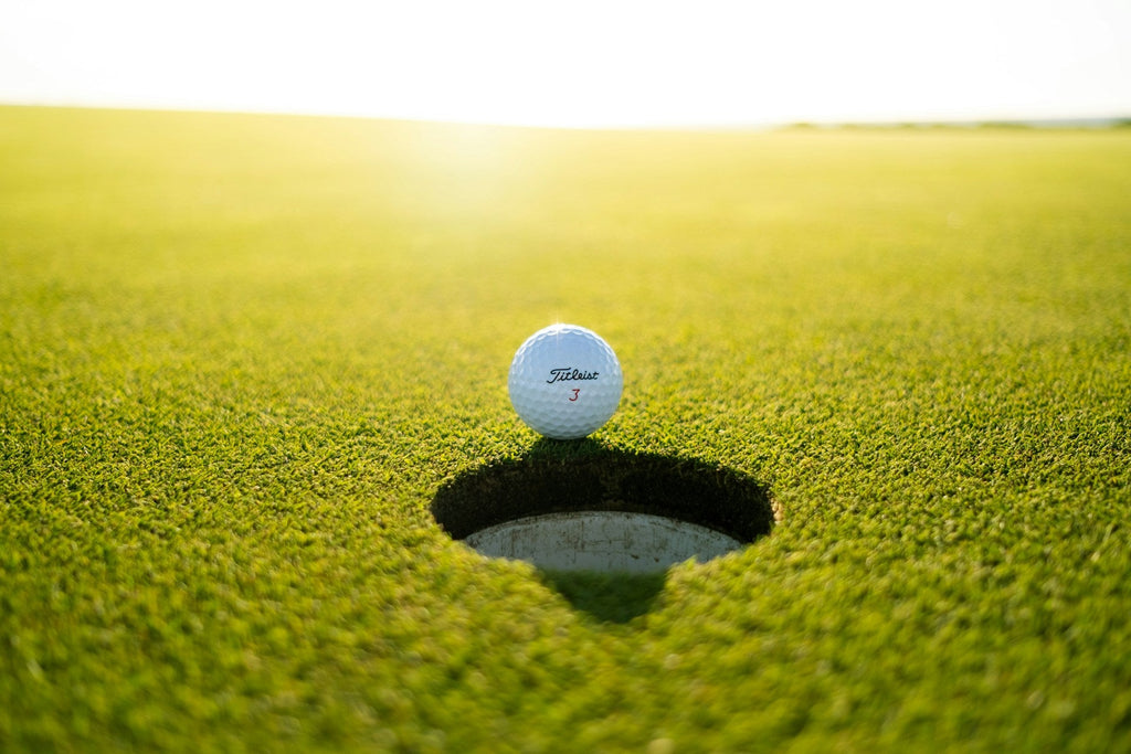 Image of a golf course with people playing golf
