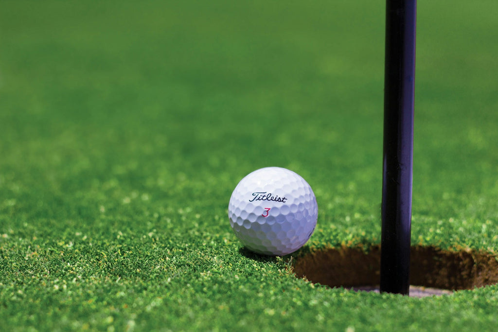 Image of a golf course with people playing golf