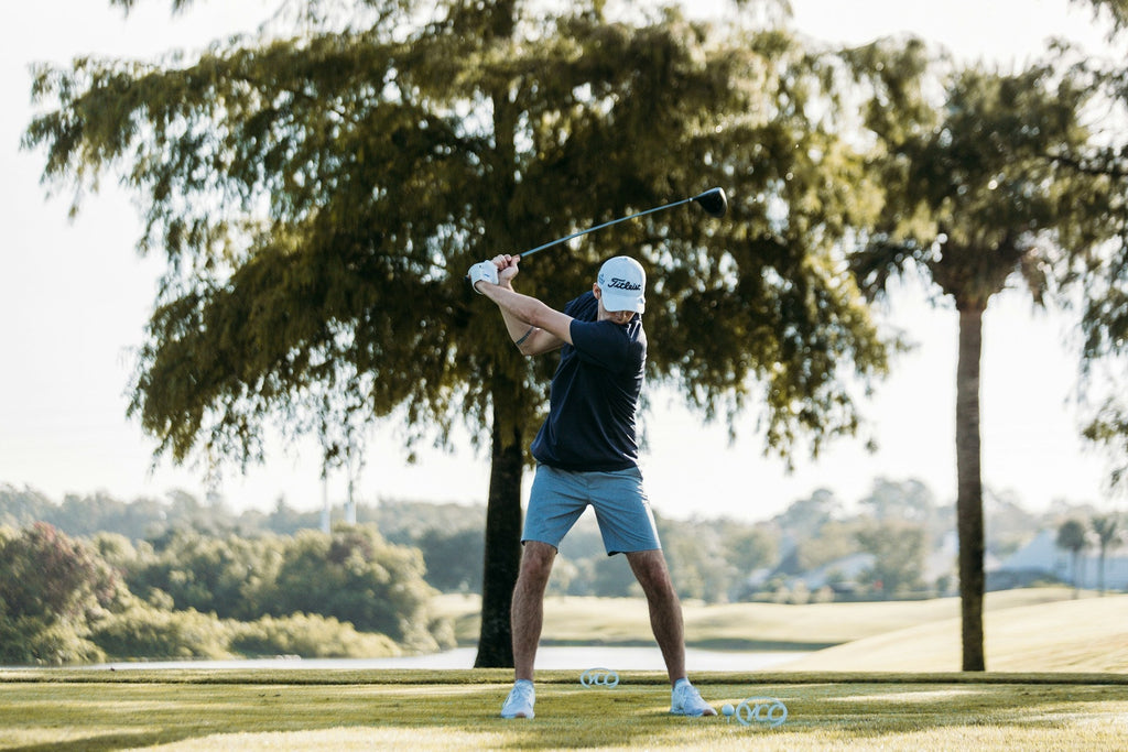 Image of a golf course with people playing golf