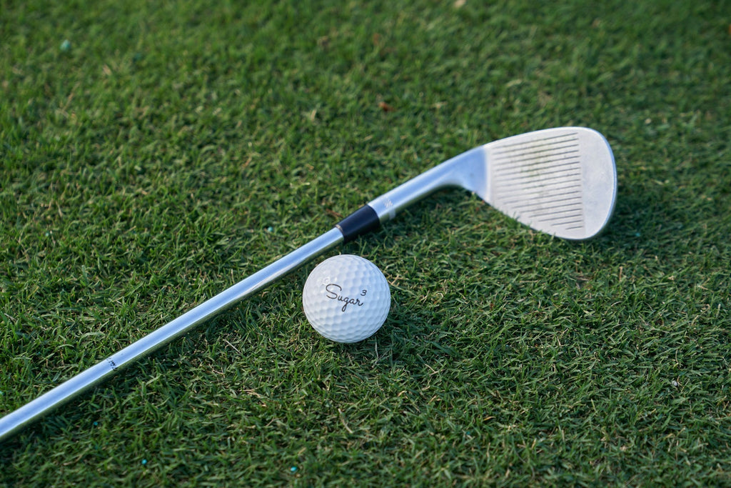 Image of a golf course with people playing golf