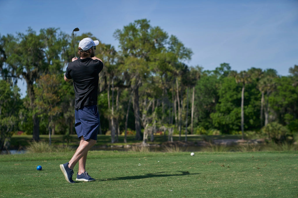 Image of a golf course with people playing golf