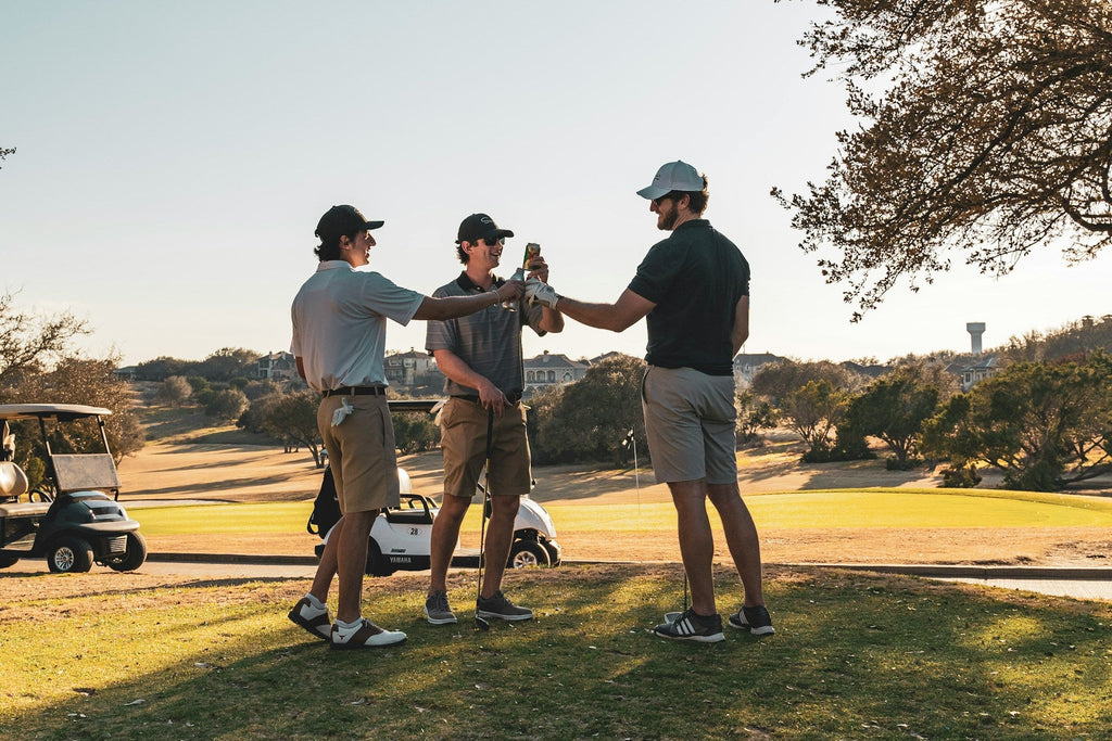Image of a golf course with people playing golf