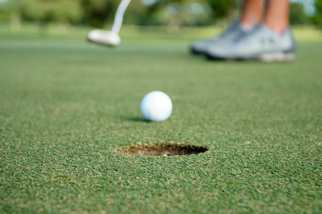 Image of a golf course with people playing golf