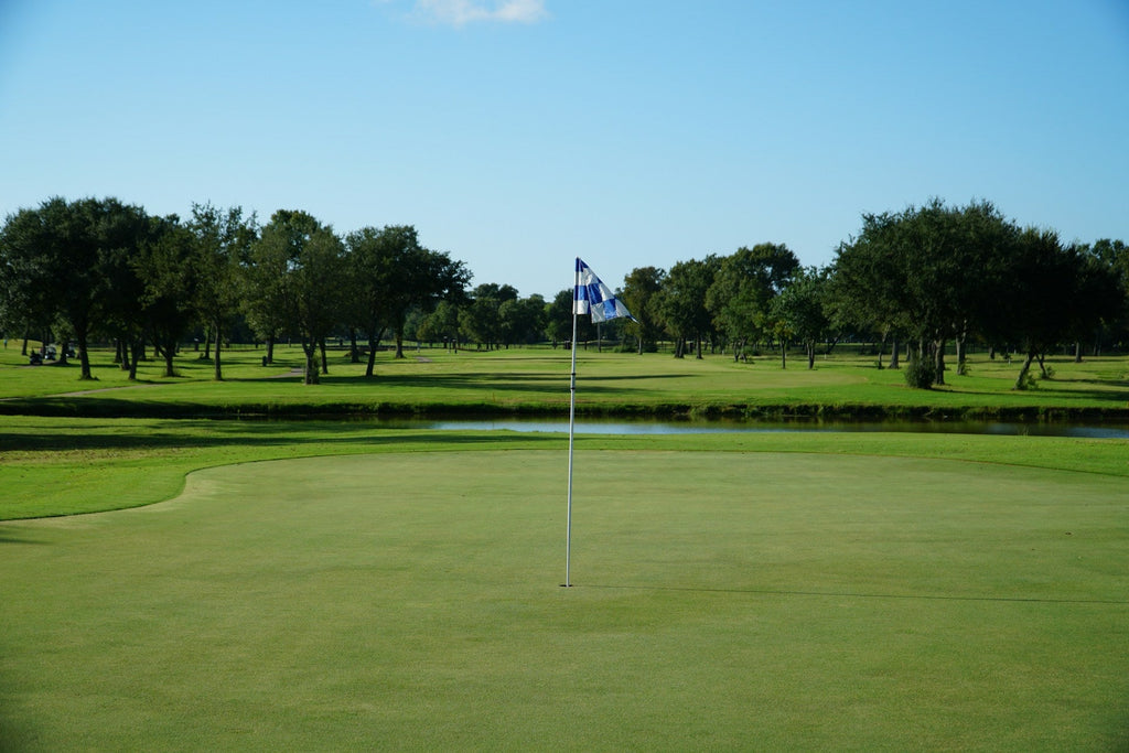 Image of a golf course with people playing golf