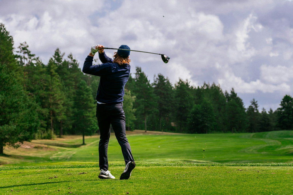 Image of a golf course with people playing golf