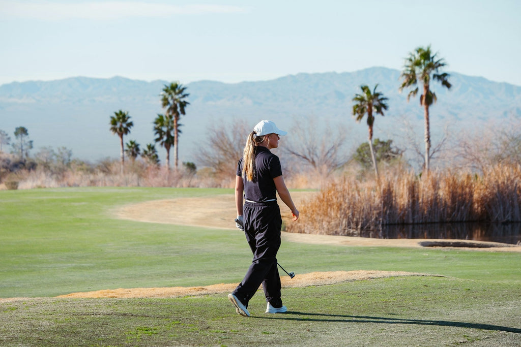 Image of a golf course with people playing golf