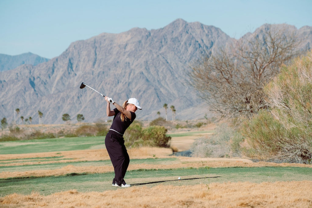 Image of a golf course with people playing golf