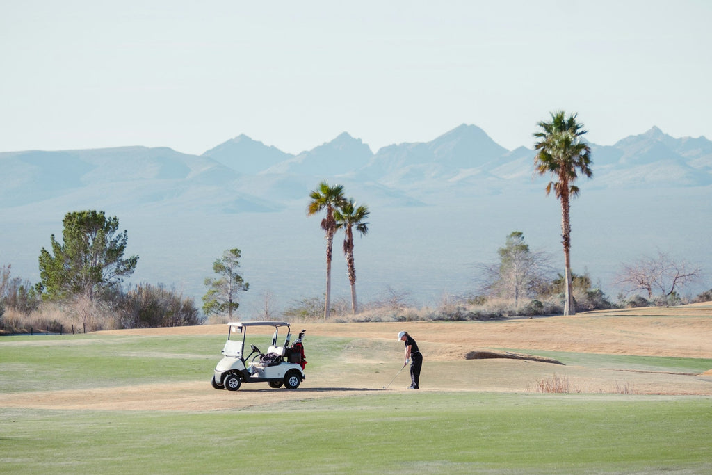 Image of a golf course with people playing golf