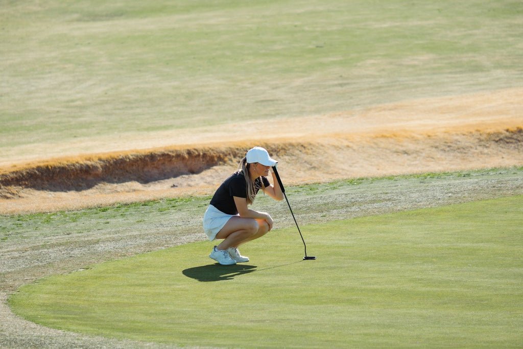 Image of a golf course with people playing golf