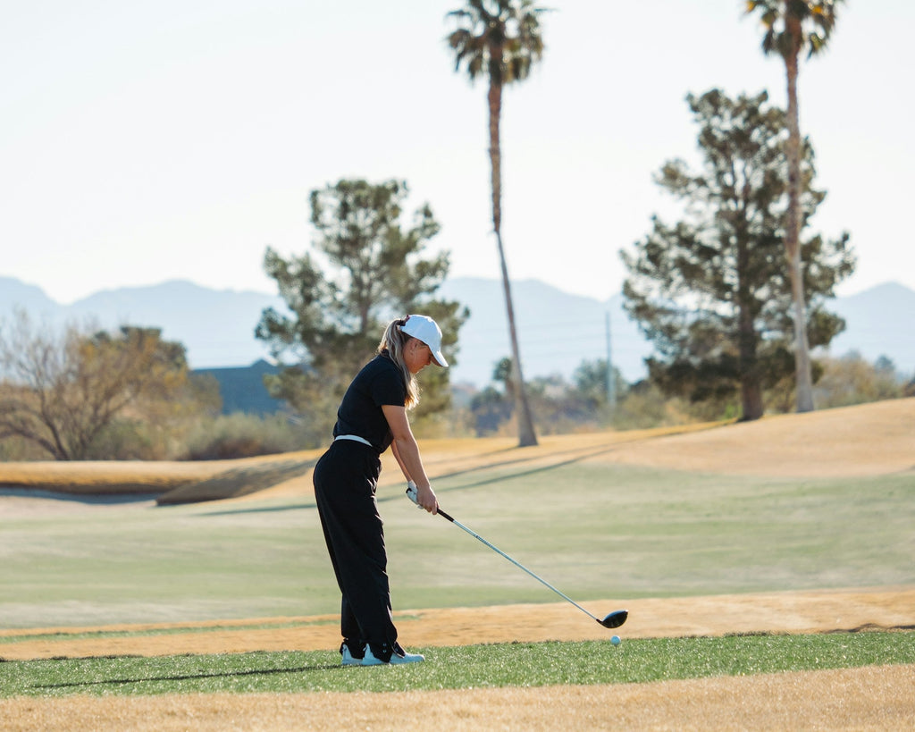 Image of a golf course with people playing golf