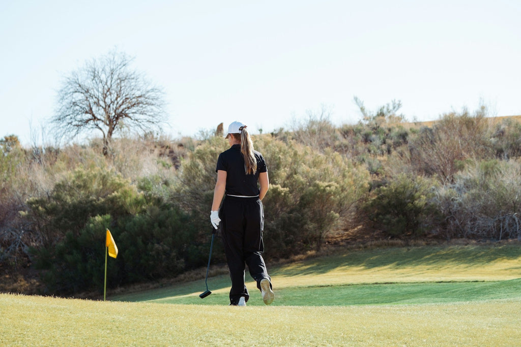 Image of a golf course with people playing golf