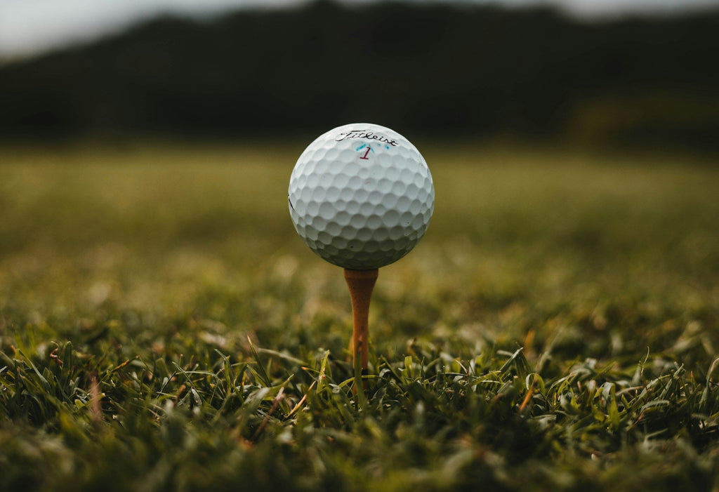 Image of a golf course with people playing golf